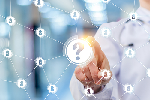 A physician selecting an option on a screen