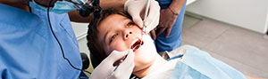Young boy receiving dental treatment